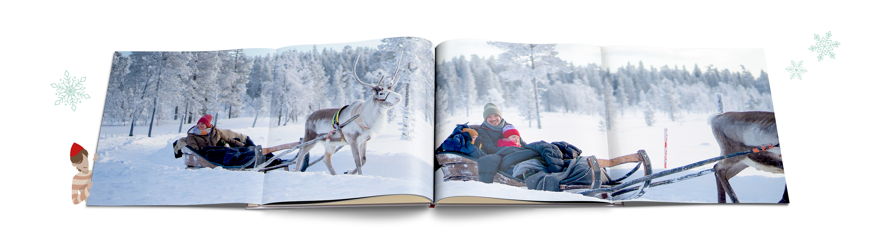 Die aufgeschlagene CEWE FOTOBUCH Panoramaseite zeigt zwei Personen in einem Schlitten.