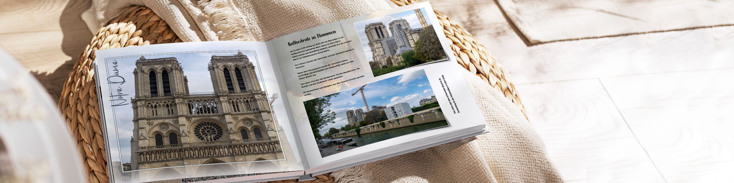 Offenes CEWE Fotobuch mit Fotos von der Kathedrale Notre-Dame in Paris und einer Stadtansicht